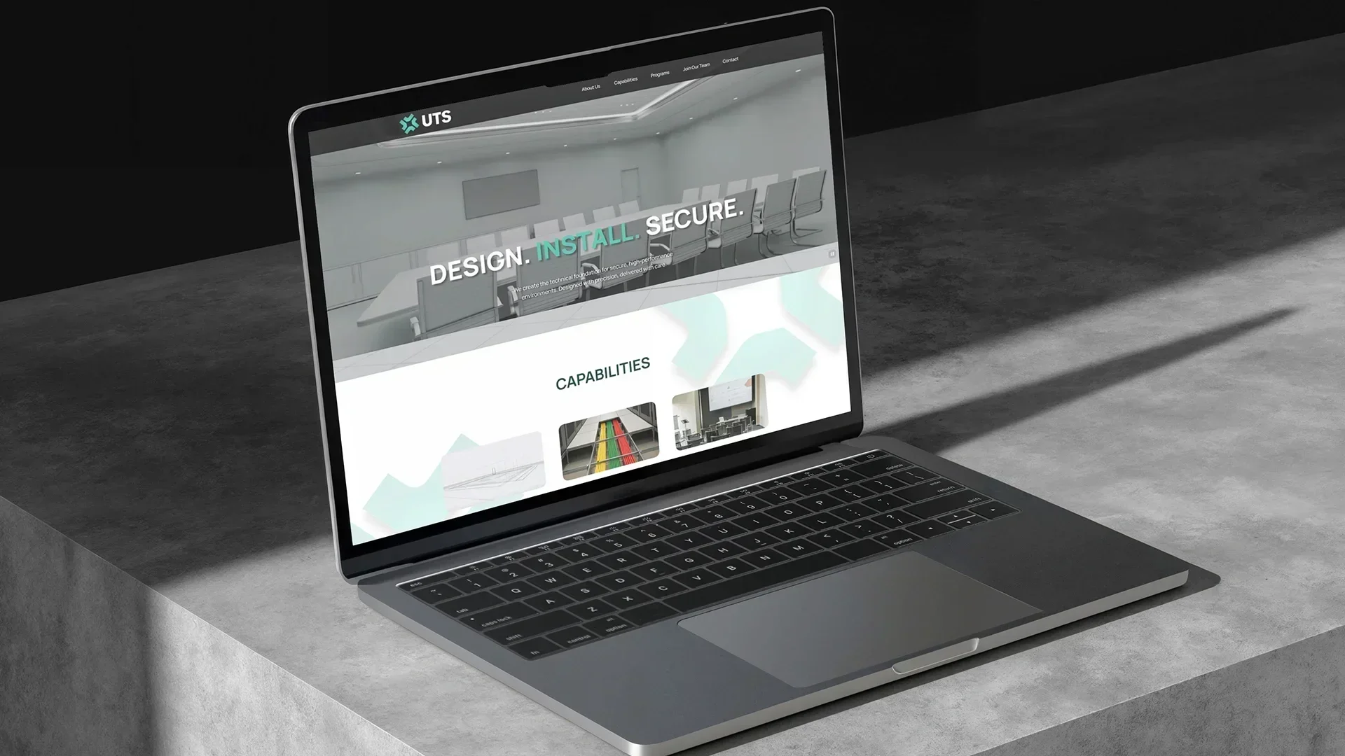 UTS corporate website redesign mockup displayed on laptop by Design Noon web design and development agency